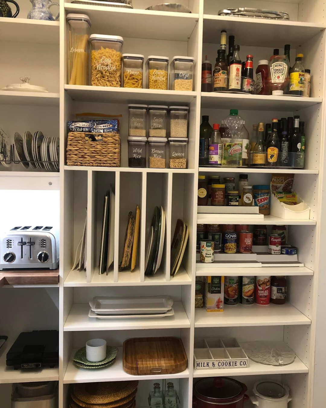 custom kitchen pantry with shelves and drawer